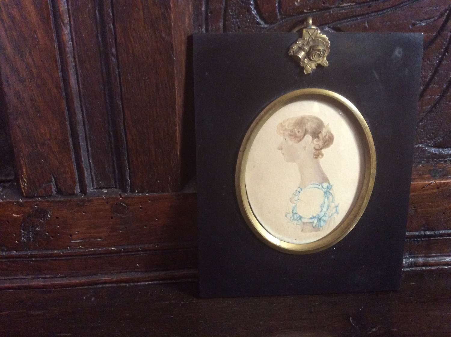 Regency period portrait miniature of a lady with blue ribbons