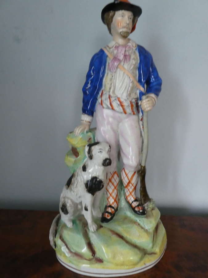 Staffordshire Huntsman figure with spaniel