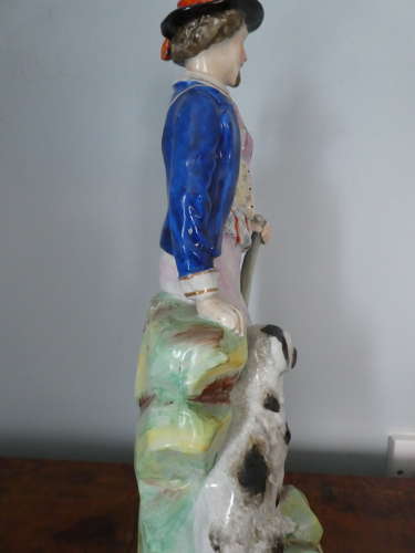 Staffordshire Huntsman figure with spaniel
