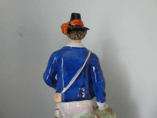 Staffordshire Huntsman figure with spaniel